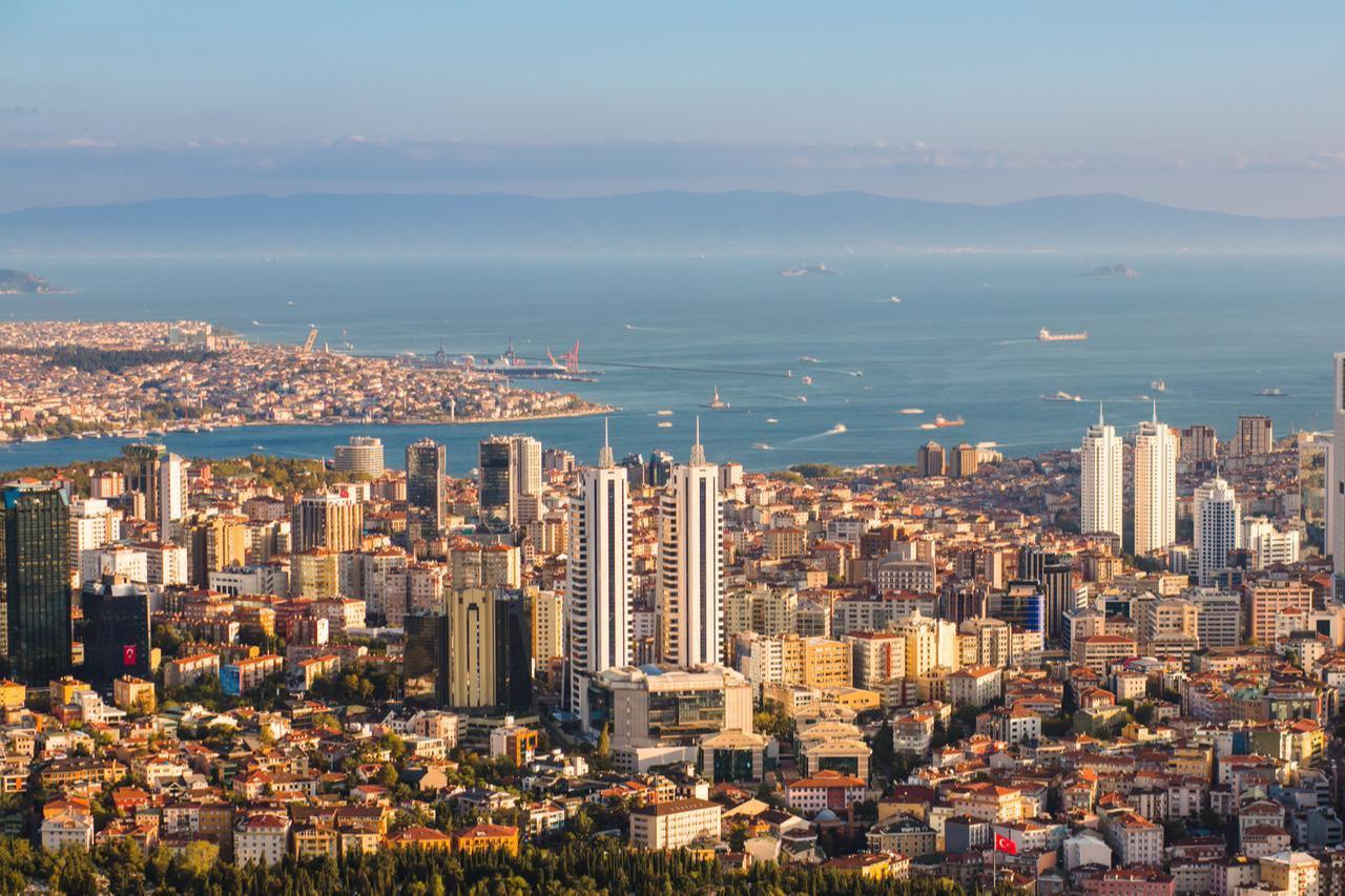 Landscape view of the Bosphorus Strait with cargo ships and passenger vessels moving between Europe and Asia in Istanbul, Türkiye. (Adobe Stock Photo)