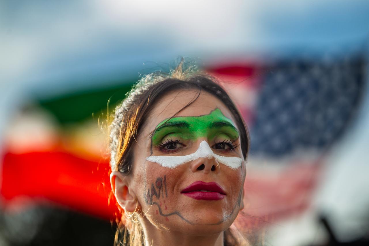 Shahrzad Shirazy wears a Iranian map painted on her face as members of the Iranian community celebrate in front of the Federal Building, Los Angeles, California, US, March 1, 2026. (AFP Photo)