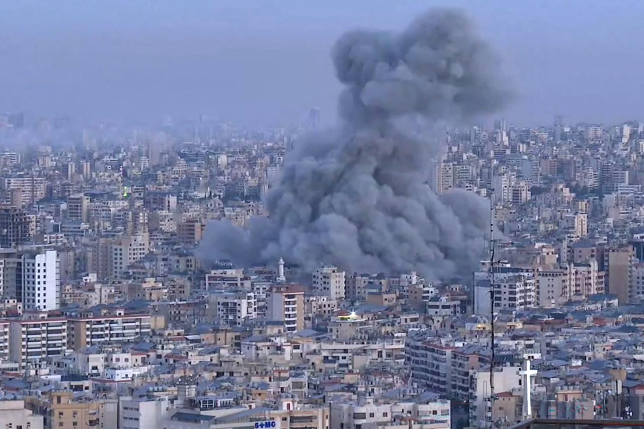 This frame grab from AFPTV video footage taken on March 3, 2026 shows smoke rising into the air after Israeli strikes hit the outskirts of Beirut. (AFP Photo)
