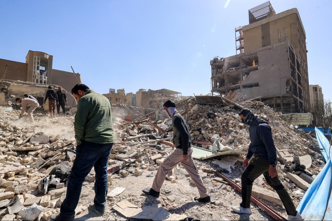 People inspect the rubble of a collapsed building near Ferdowsi square in Tehran on March 3, 2026. (AFP Photo)