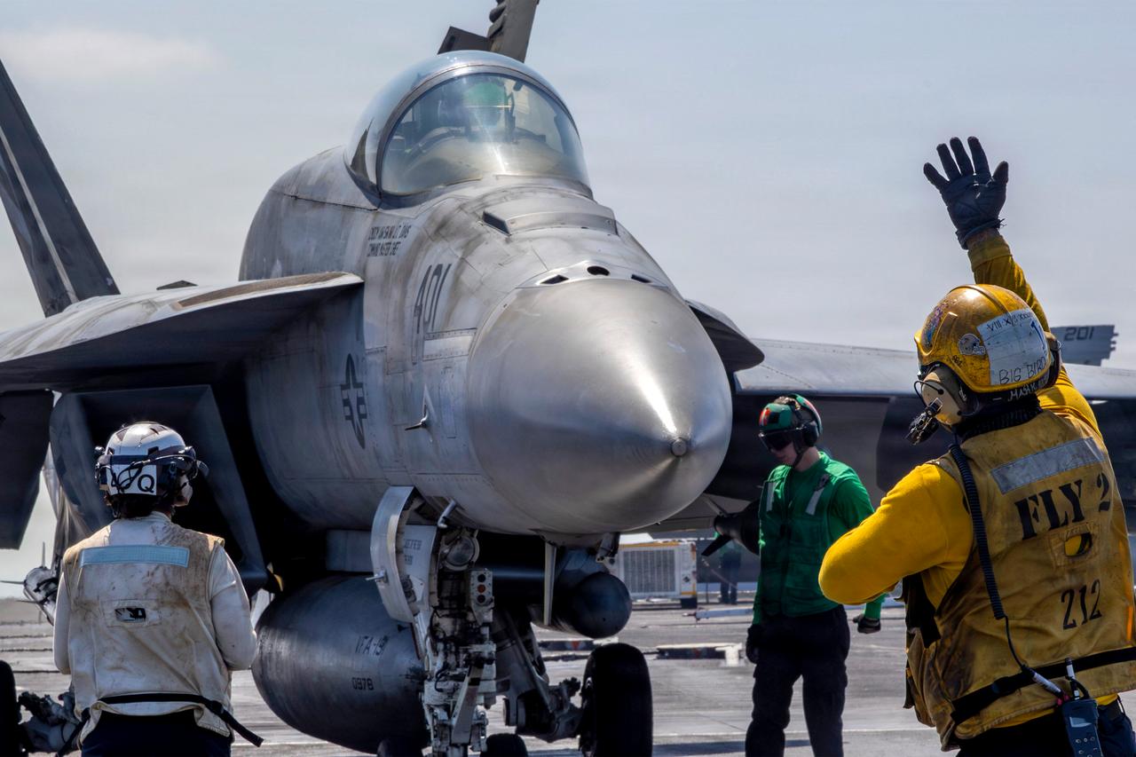 An F/A-18E Super Hornet is preparing to launch from the flight deck of the Nimitz-class aircraft carrier USS Abraham Lincoln (CVN 72) on March 2, 2026. (Photo by US NAVY/AFP)