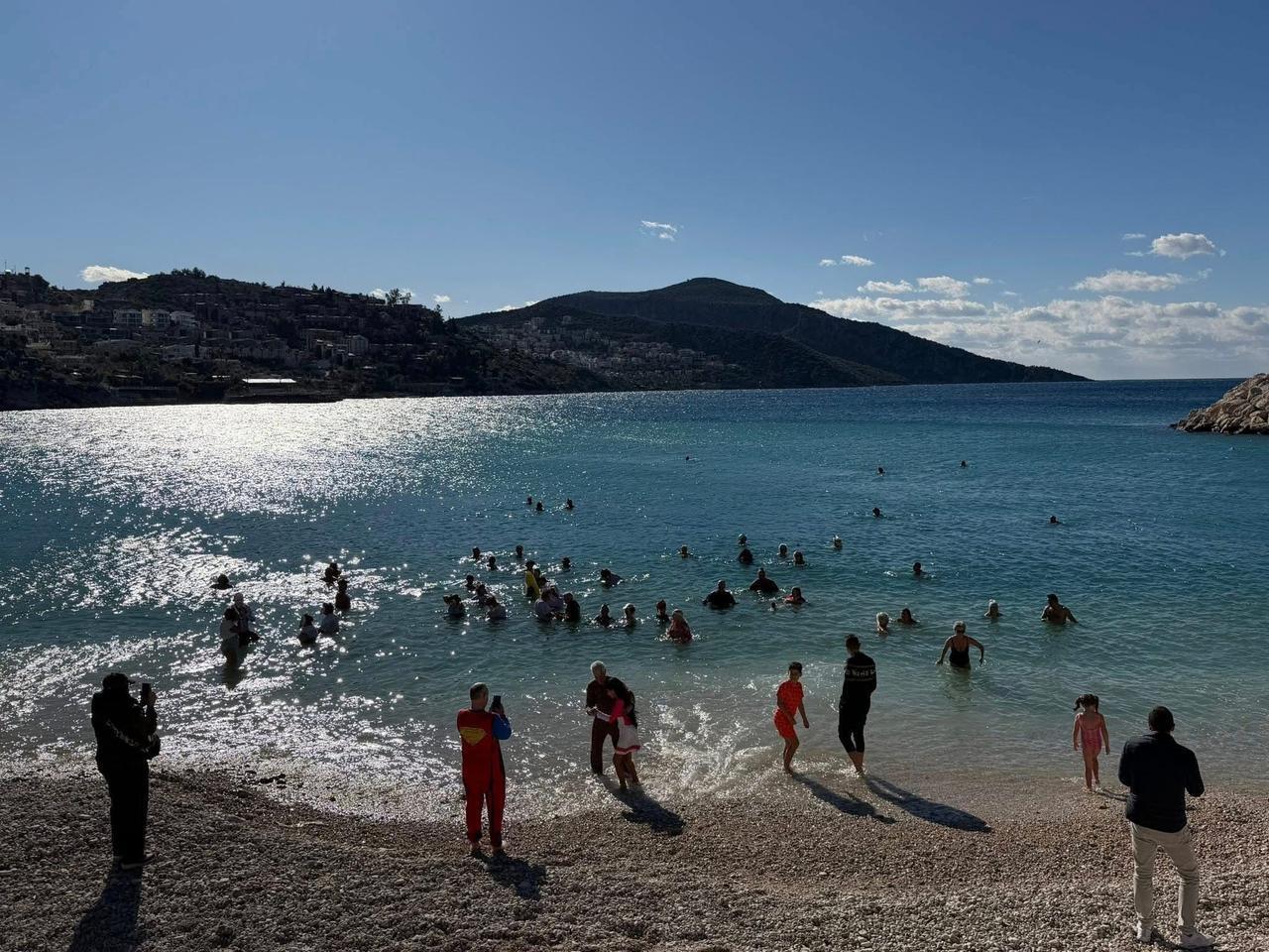 Foreign residents and visitors wearing eye-catching costumes swim and walk in the sea during New Year celebrations in Antalya’s Kas district, Türkiye, Jan. 2, 2026. (AA Photo)