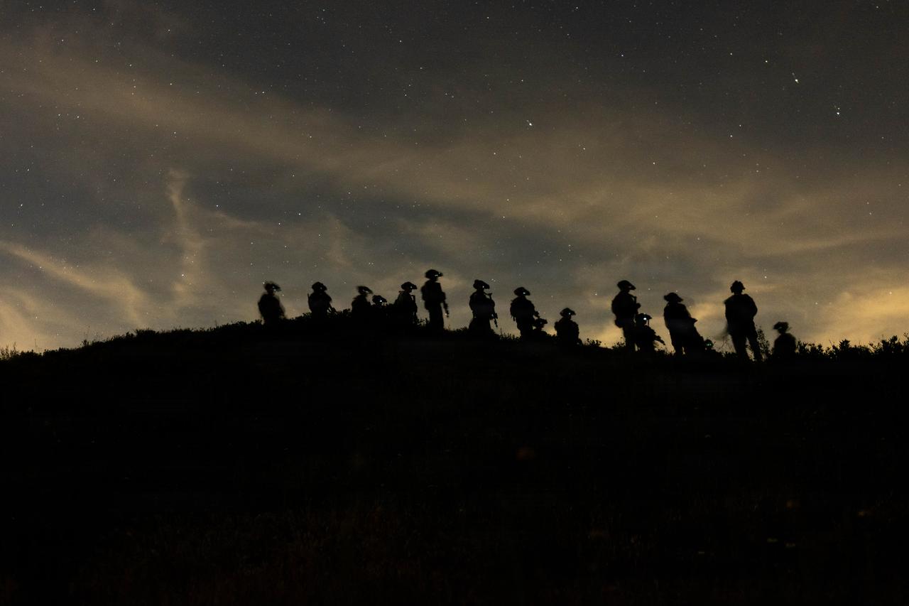 U.S. Marines move tactically during a simulated night raid at Raid Leaders Course 26-1, Marine Corps Base Camp Pendleton, California, March 23, 2026. (Photo via U.S. Marine Corps)