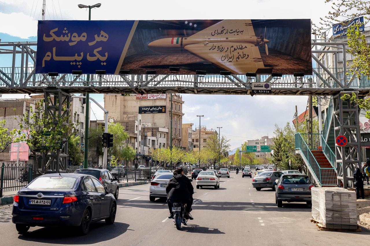 A billboard with the Persian caption "every missile has a message," depicting an Iranian combat drone, is displayed along a road used by motorists in Tehran, March 30, 2026. (AFP Photo)