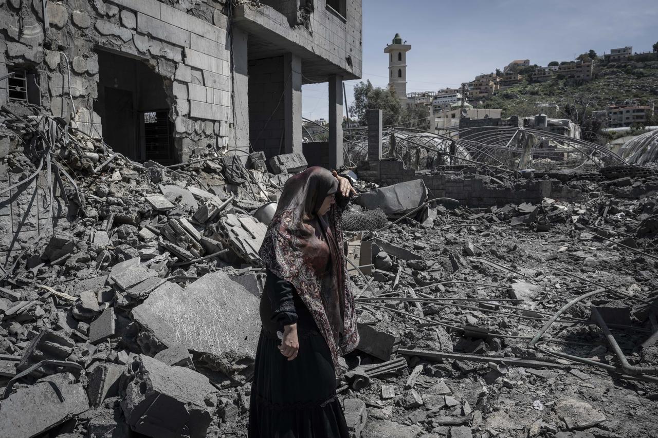 Lebanese residents inspect the heavy damage to their homes and buildings following an Israeli airstrike on the town of Sakesakiye, near Sidon in southern Lebanon, on March 28, 2026. (AA Photo)