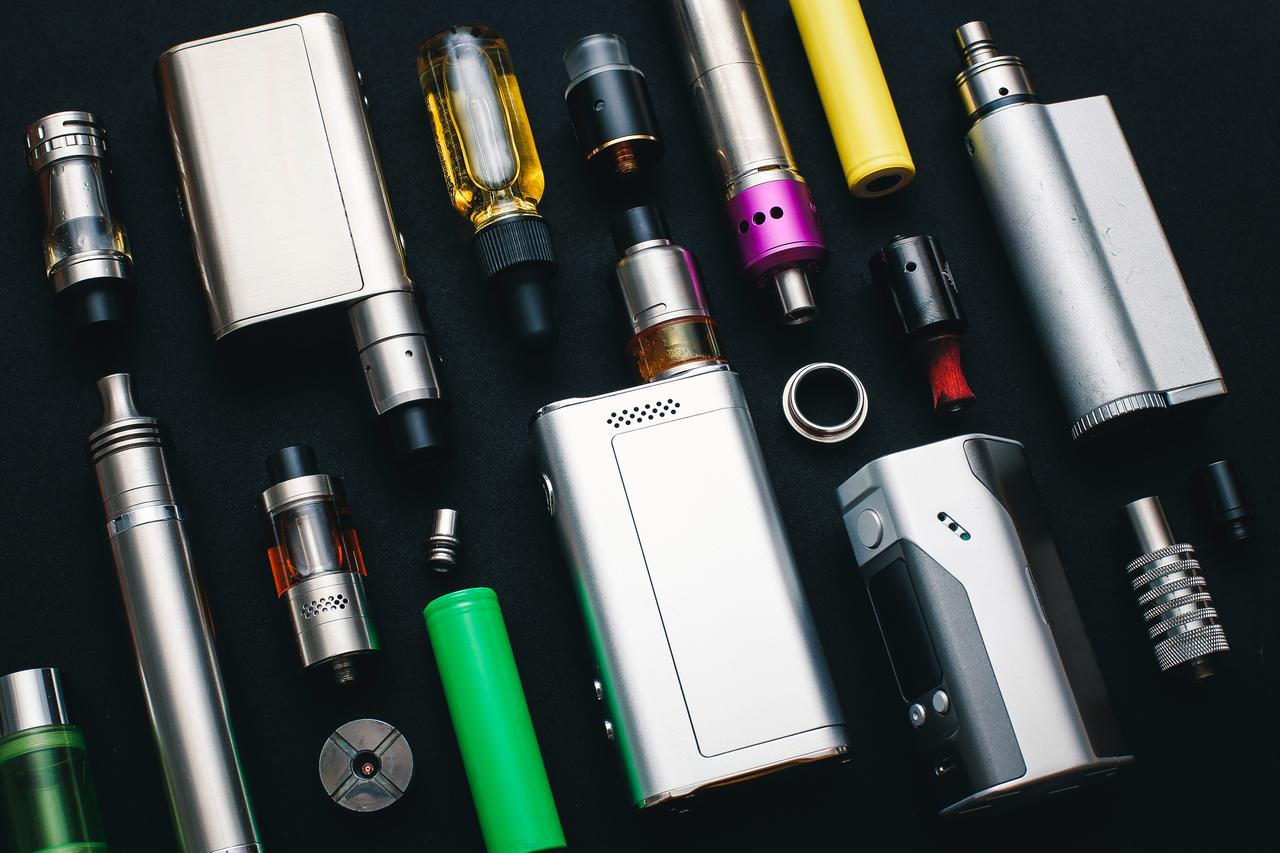 A selection of vaping devices and components displayed on a dark surface, accessed on March 31, 2026. (Adobe Stock Photo)