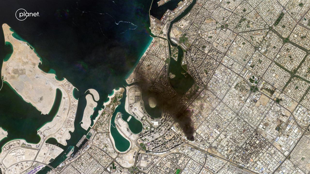 This handout satellite image, taken by 2026 Planet Labs PBC on March 1, 2026, shows a smoke plume billowing in Dubai after a projectile strike. (Photo by 2026 Planet Labs PBC/AFP)