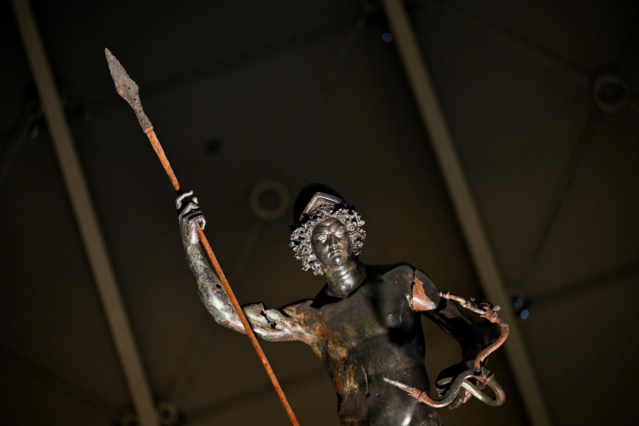 The ancient bronze statue of Mars is displayed on a column inside the Zeugma Mosaic Museum in Gaziantep, Türkiye, March 3, 2026. (AA Photo)