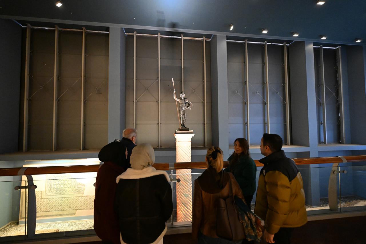 The ancient bronze statue of Mars is displayed on a column inside the Zeugma Mosaic Museum in Gaziantep, Türkiye, March 3, 2026. (AA Photo)
