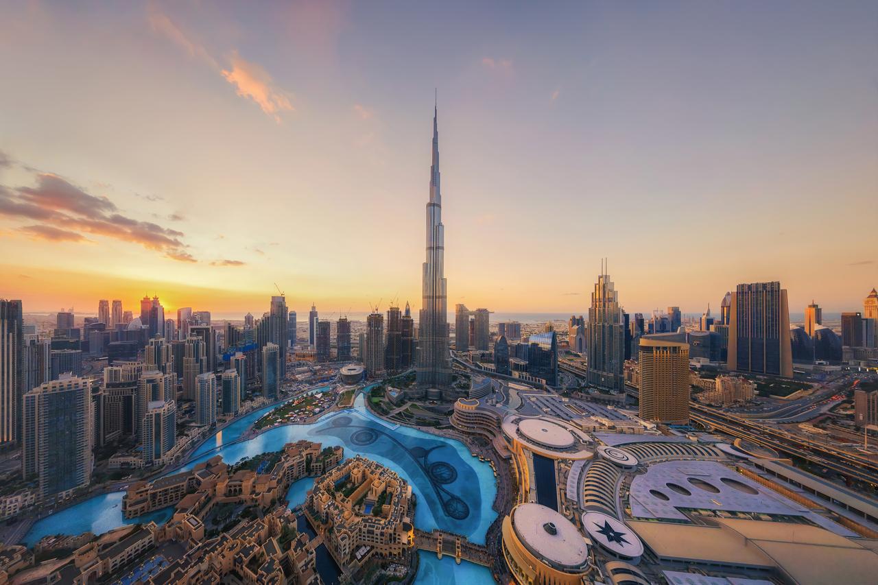 Overhead view of Burj Khalifa, the surrounding Dubai skyline in UAE. (Adobe Stock Photo)