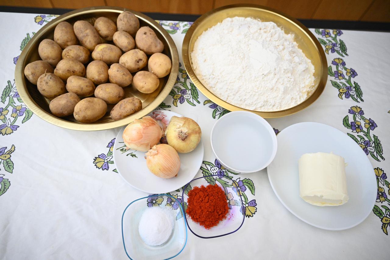 Ingredients used to prepare hingel, including potatoes, flour, onions, spices and butter, are displayed in Sivas, Türkiye, March 4, 2026. (AA Photo)