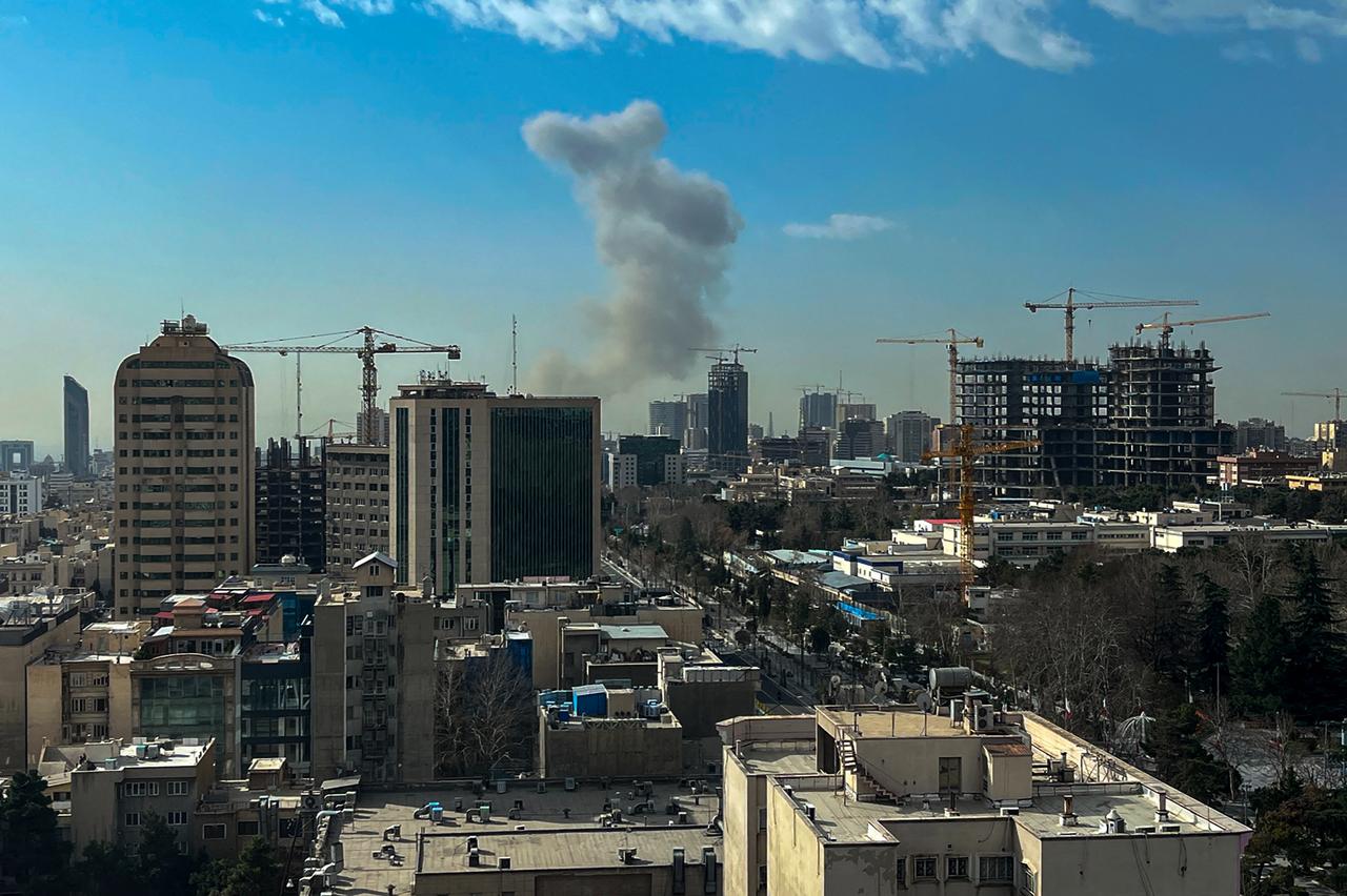 A plume of smoke rises following a reported explosion in Tehran on February 28, 2026. (AFP Photo)
