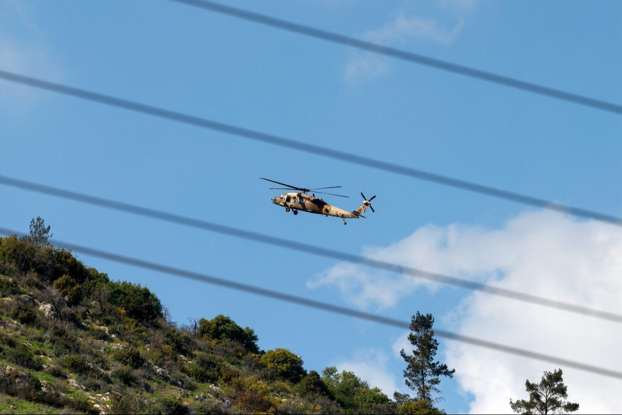 An Israeli Air Force UH-60 Black Hawk helicopter flies over the border area with southern Lebanon in northern Israel on March 2, 2026. (AFP Photo)