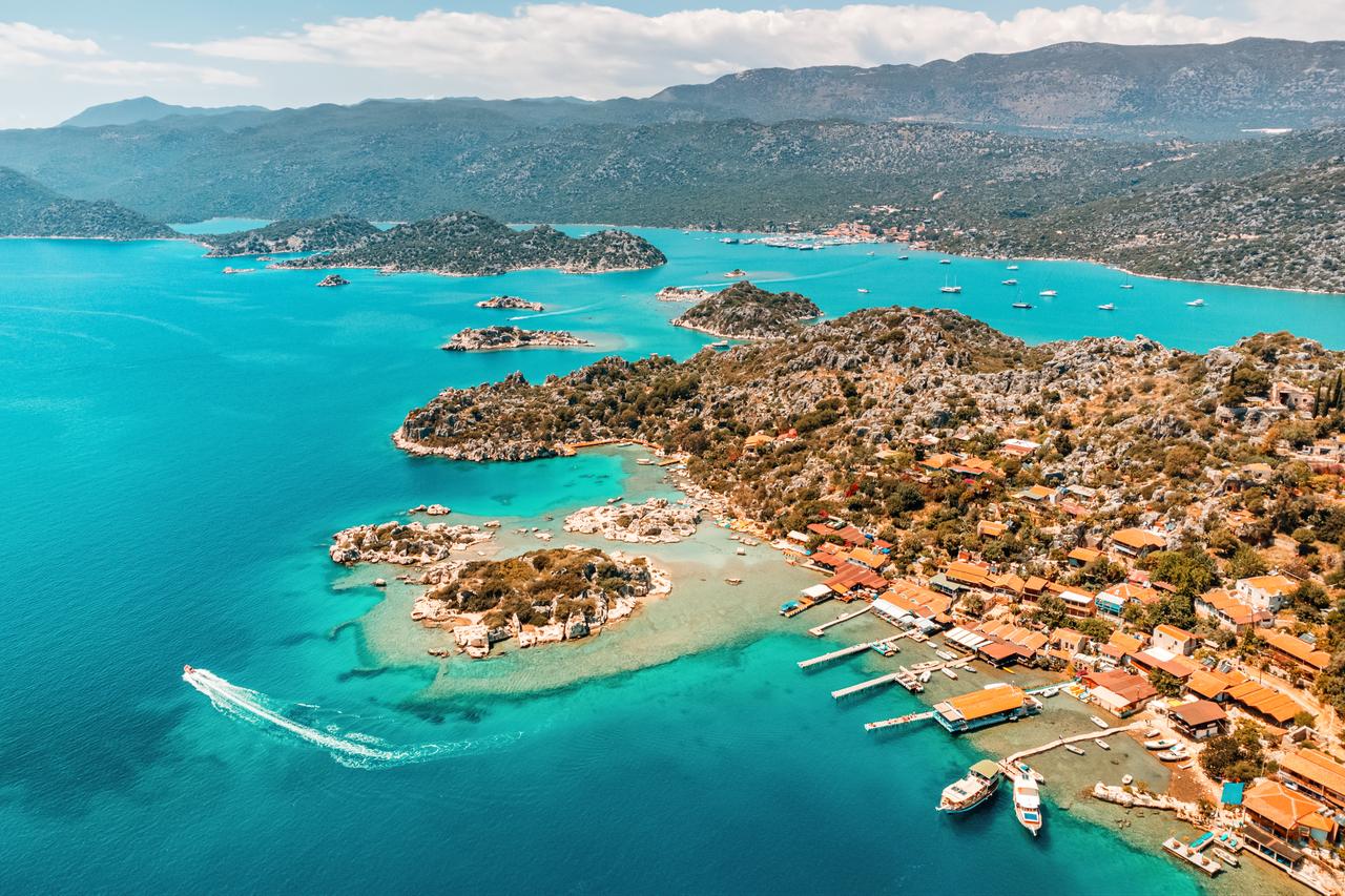 Aerial view of Simena Castle, Kaleucagiz village and the submerged ruins of Kekova in Antalya, Türkiye. (Adobe Stock Photo)