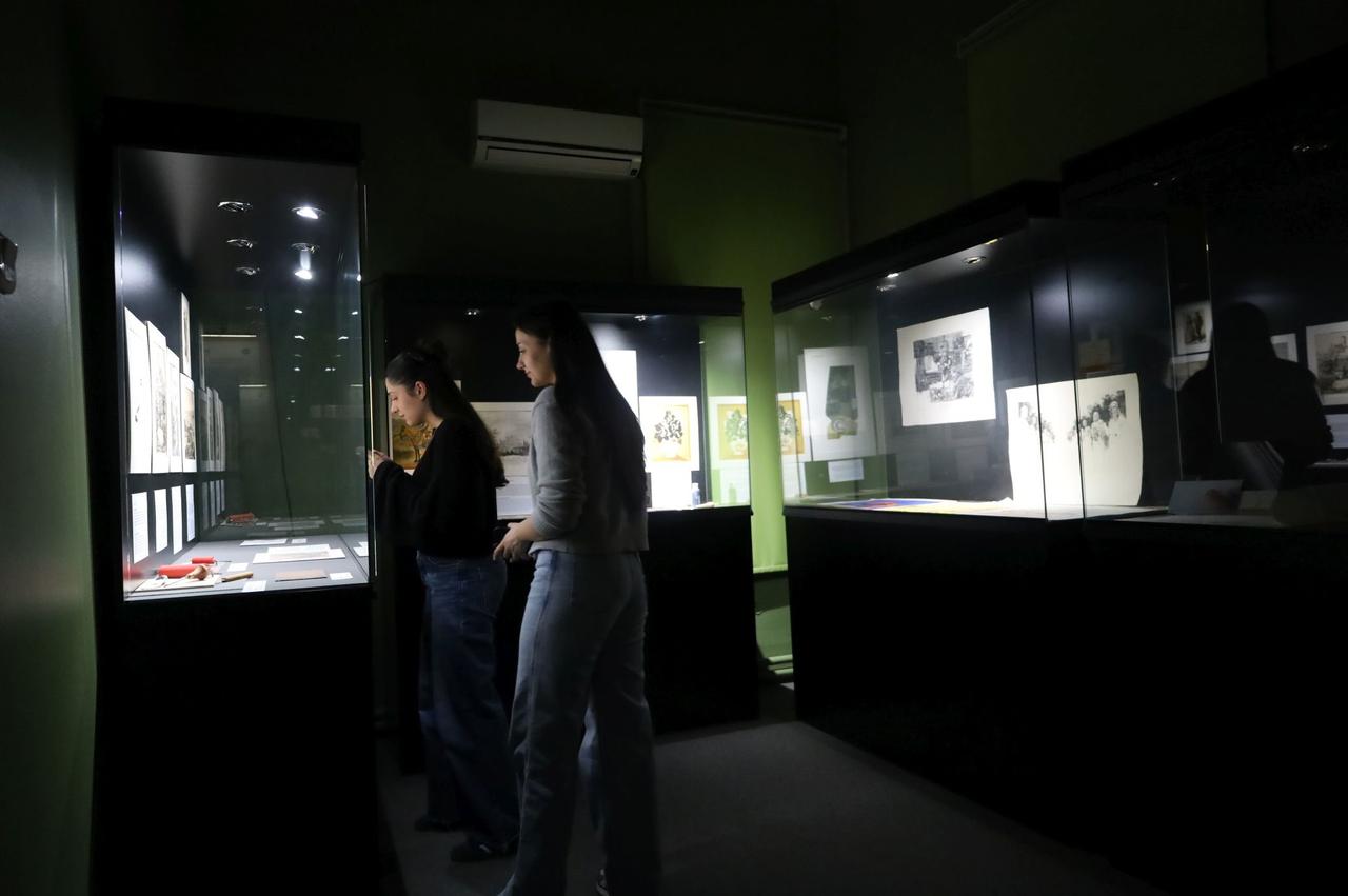 Visitors examine displays inside the Paper and Book Arts Museum at Ege University in Izmir, Türkiye. (IHA Photo)