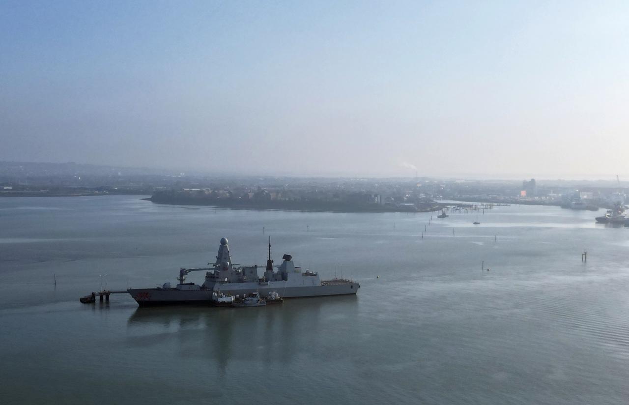 An aerial view shows HMS Dragon, a Royal Navy Type 45 Daring-class air-defence destroyer warship, moored at the HMNB Portsmouth Upper Harbour Ammunition Facility (UHFC), outside HM Naval Base Portsmouth, pictured from Gosport, on the south coast of England, March 4, 2026. (AFP Photo)