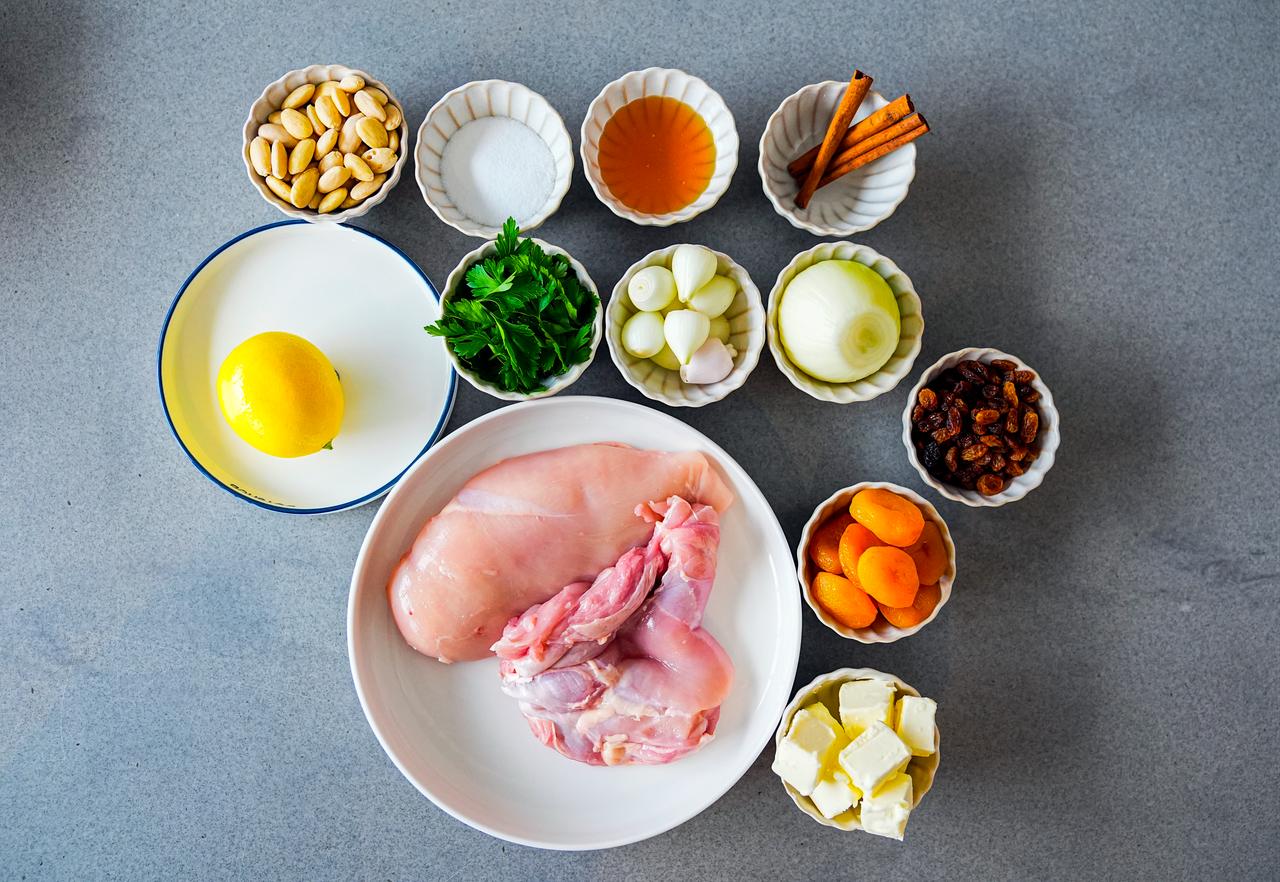 Ingredients used to prepare the traditional Ottoman dish honeyed Mahmudiye, including chicken, dried apricots, currants, almonds, butter and spices, are displayed before cooking in Istanbul, Türkiye, March 4, 2026. (AA Photo)