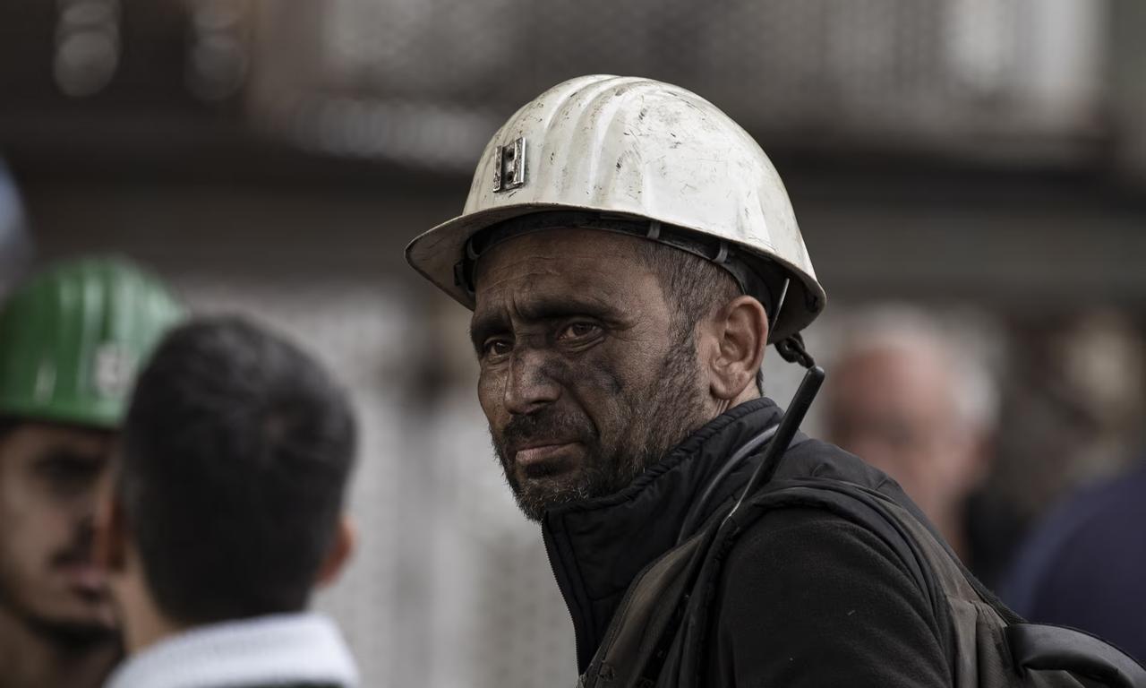 A co-worker of the coal miners trapped under the rubble waits at the explosion site. (AA Photo)