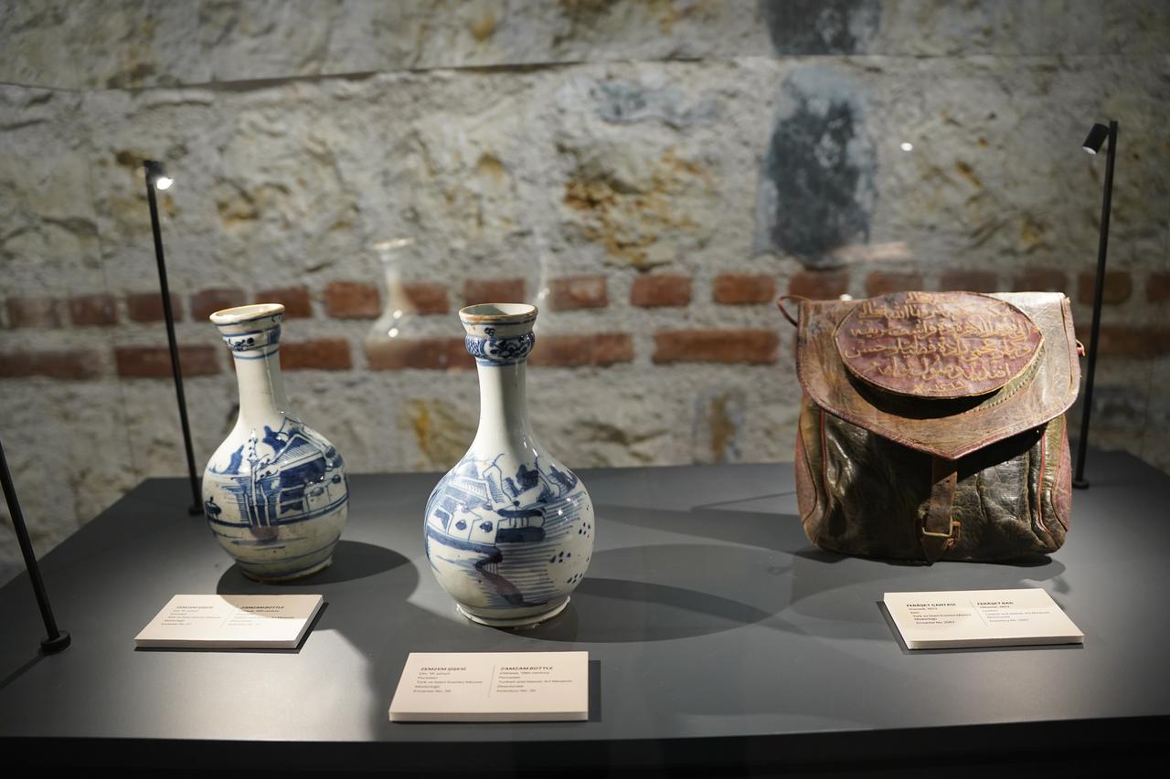 Zamzam water bottles and a historic pilgrim pouch are exhibited at the “Ottoman Sultans’ Passion: Sacred Relics” exhibition in Istanbul, Türkiye, March 4, 2026. (AA Photo)