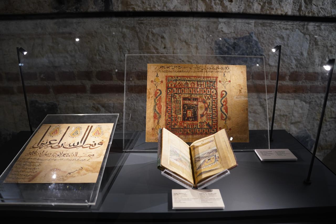 Illuminated Qur’an manuscripts and calligraphic works are exhibited as part of the “Ottoman Sultans’ Passion: Sacred Relics” exhibition at Rami Library in Istanbul, Türkiye, March 4, 2026. (AA Photo)