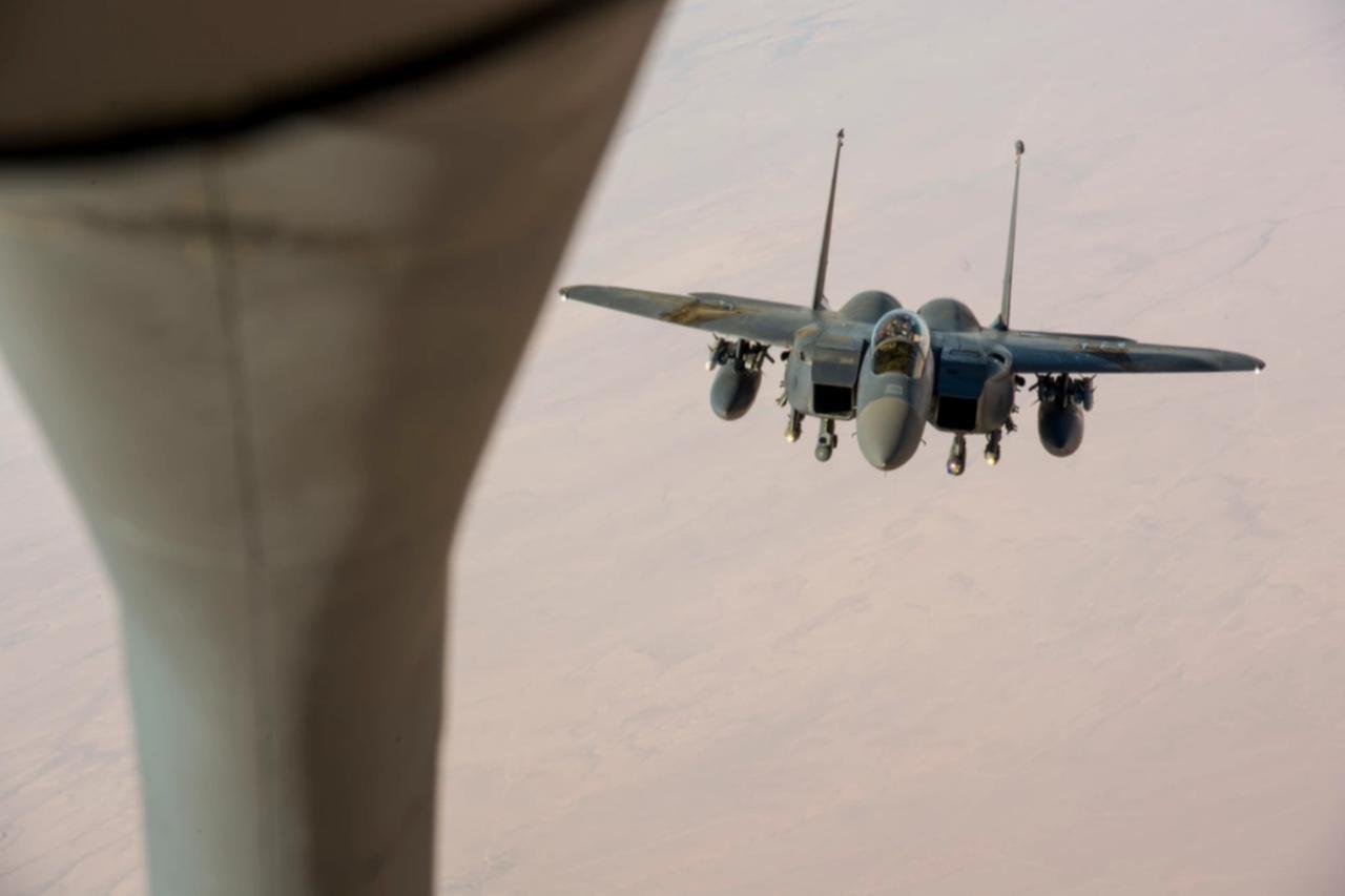 A U.S. Air Force F-15 Eagle assigned to the 332nd Air Expeditionary Wing approaches the boom of a KC-135 Stratotanker to receive in flight fuel during a mission in support of Operation Inherent Resolve over Iraq, Oct. 5, 2018. (USAF Photo)
