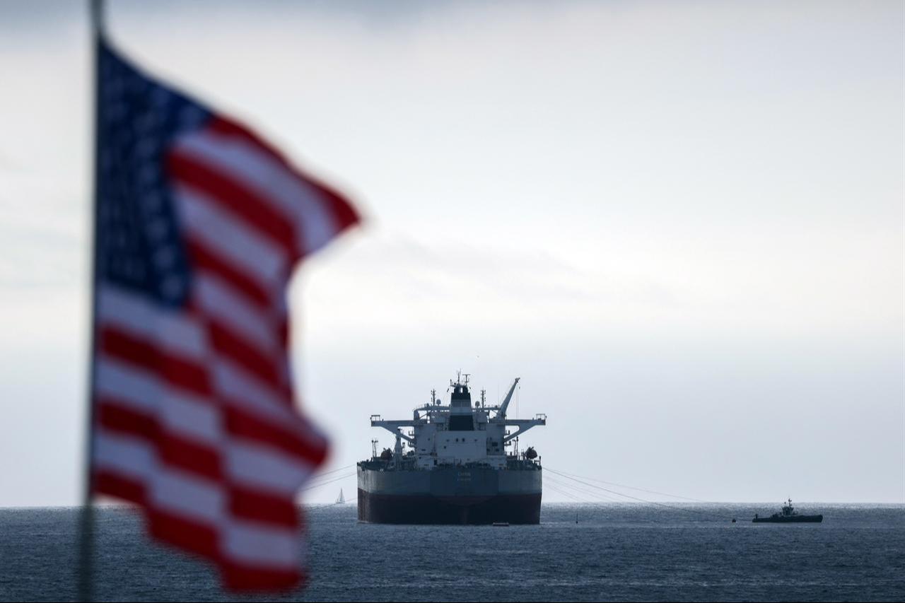 A US flag flutters in the wind as the CHIOS crude oil tanker sits anchored off the coast of Chevron's El Segundo Refinery in El Segundo, California, on March 4, 2026. (AFP Photo)