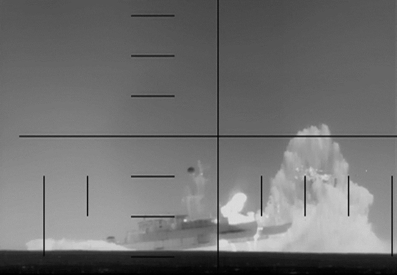 This frame grab from a video on March 4, 2026, shows periscope footage of a US Navy submarine firing on and sinking an Iranian warship in the Indian Ocean. (Photo by US Department of Defense/AFP)