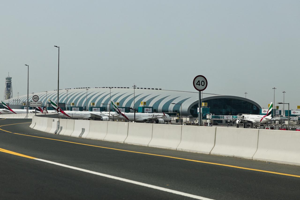 Emirates airline planes are parked on the tarmac at Dubai International Airport in Dubai on March 2, 2026. (AFP Photo)