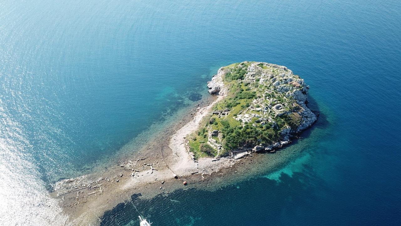 It allows visitors to walk from Gumusluk Bay to Tavsan Island, Bodrum, Mugla, March 6, 2026. (IHA Photo)