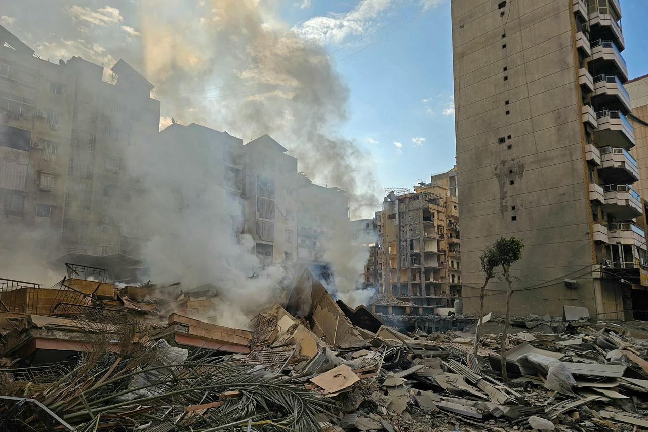 Smoke rises from the rubble of destroyed buildings at the site of an Israeli airstrike that targeted Haret Hreik neighbourhood in Beirut's southern suburbs, Lebanon on March 7, 2026. (AFP Photo)
