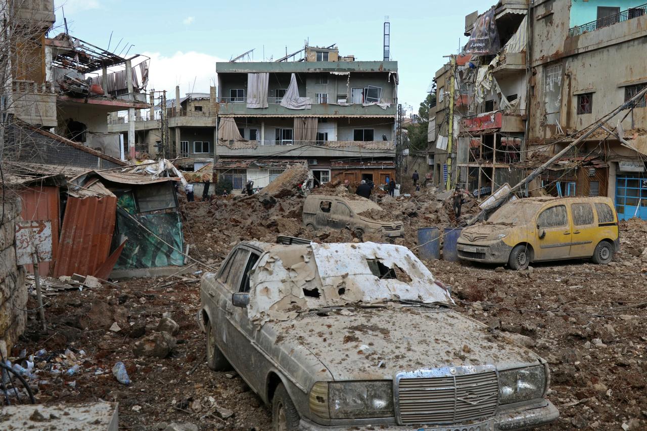 This photograph taken during a media tour organised by the Hezbollah shows people inspecting the destruction at Nabi Sheet town of Lebanon on March 7, 2026. (AFP Photo)