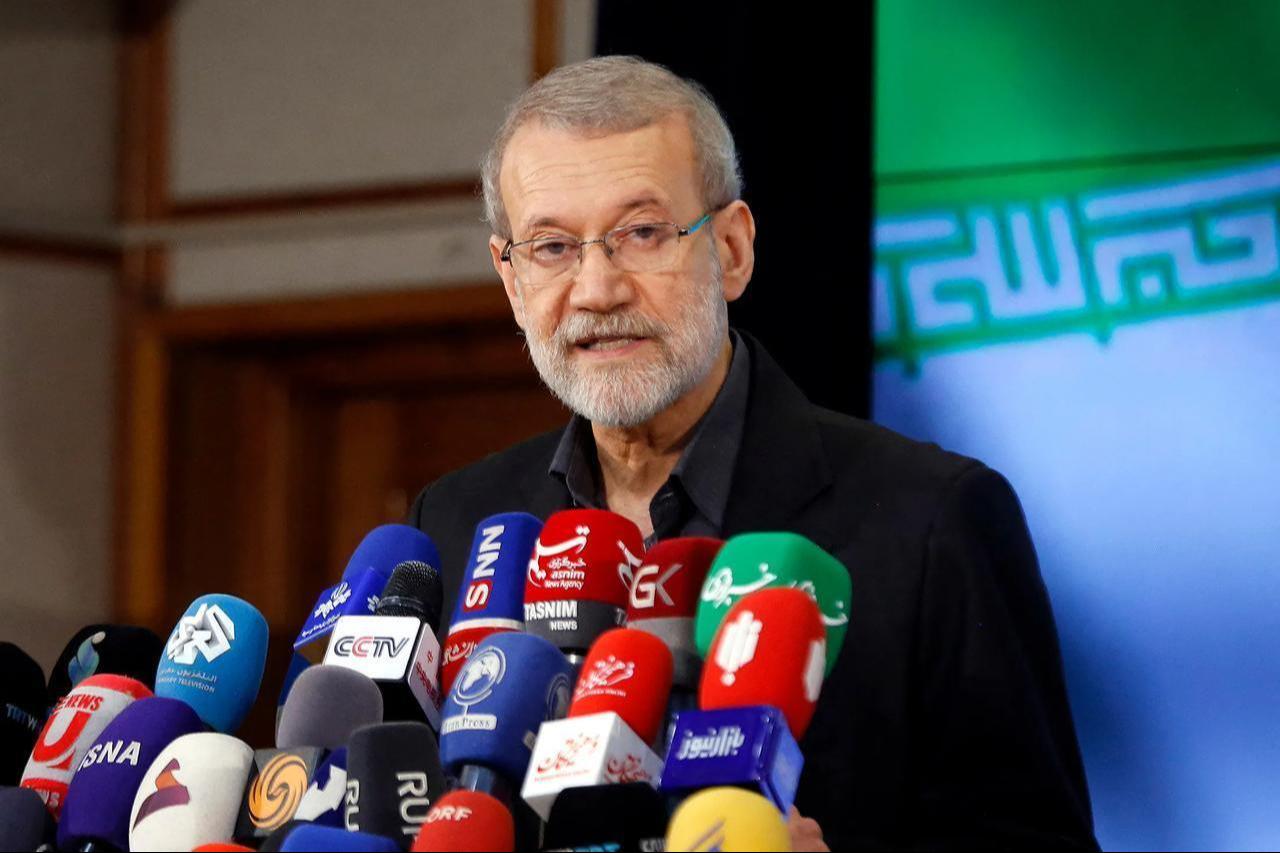This image features Ali Larijani addressing the media during a press conference. (AFP Photo)