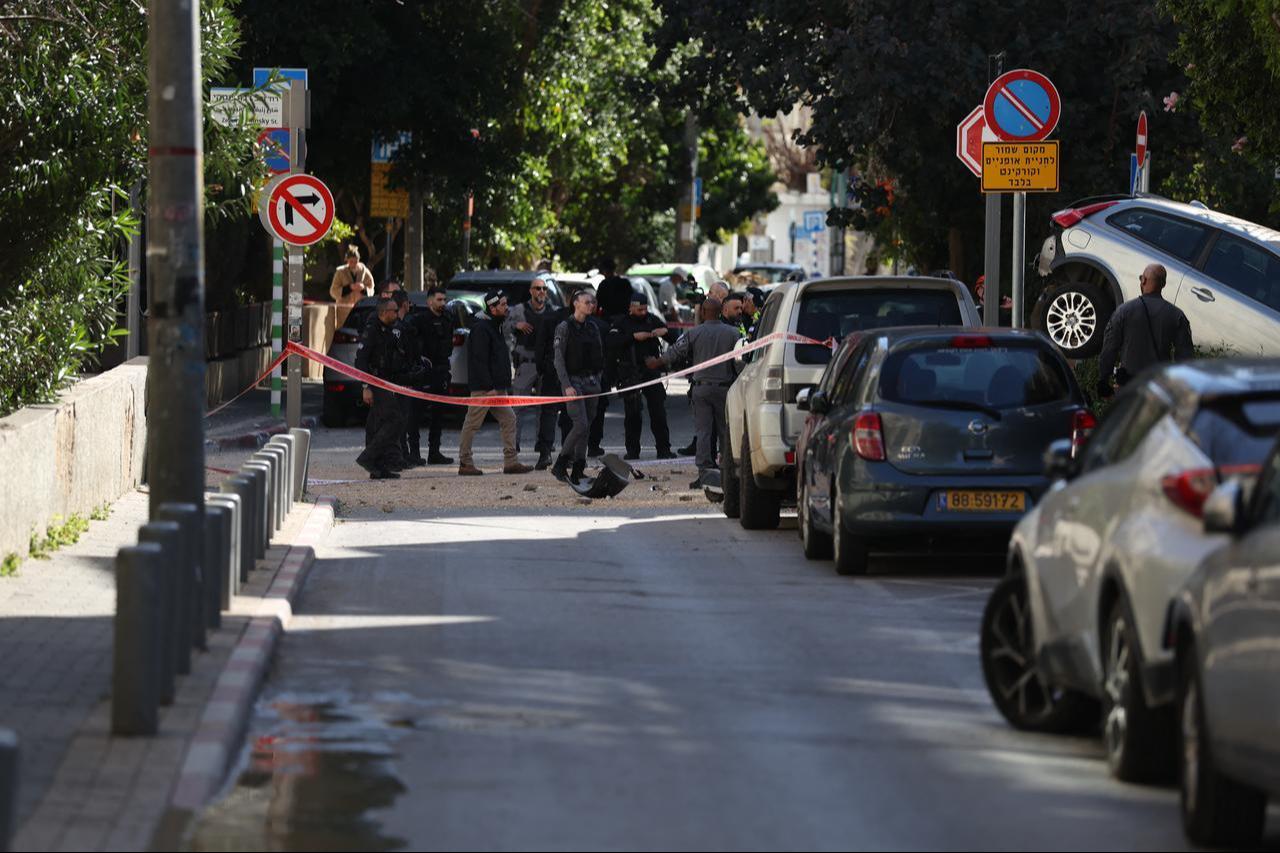 Israeli police gather at the site of an Iranian airstrike in Tel Aviv on March 8, 2026. (AFP Photo)