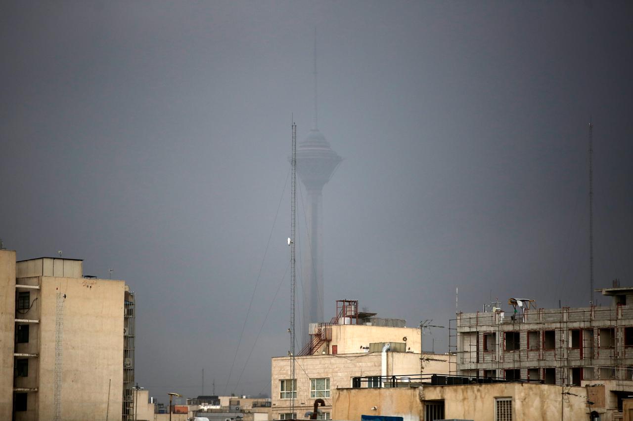 Iran warns of toxic rain after Tehran oil fires, urges wearing masks