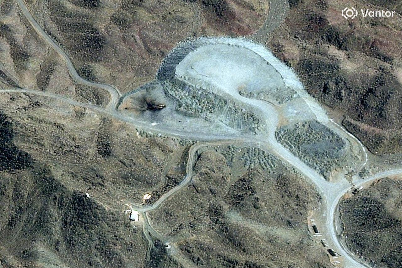 This handout satellite image shows a closer view of destroyed vehicles at the Pickaxe Mountain tunnel complex, adjacent to the Natanz Nuclear Facility near Natanz, Isfahan province, in central Iran, March 7, 2026. (Photo by Satellite image ©2026 Vantor/AFP)