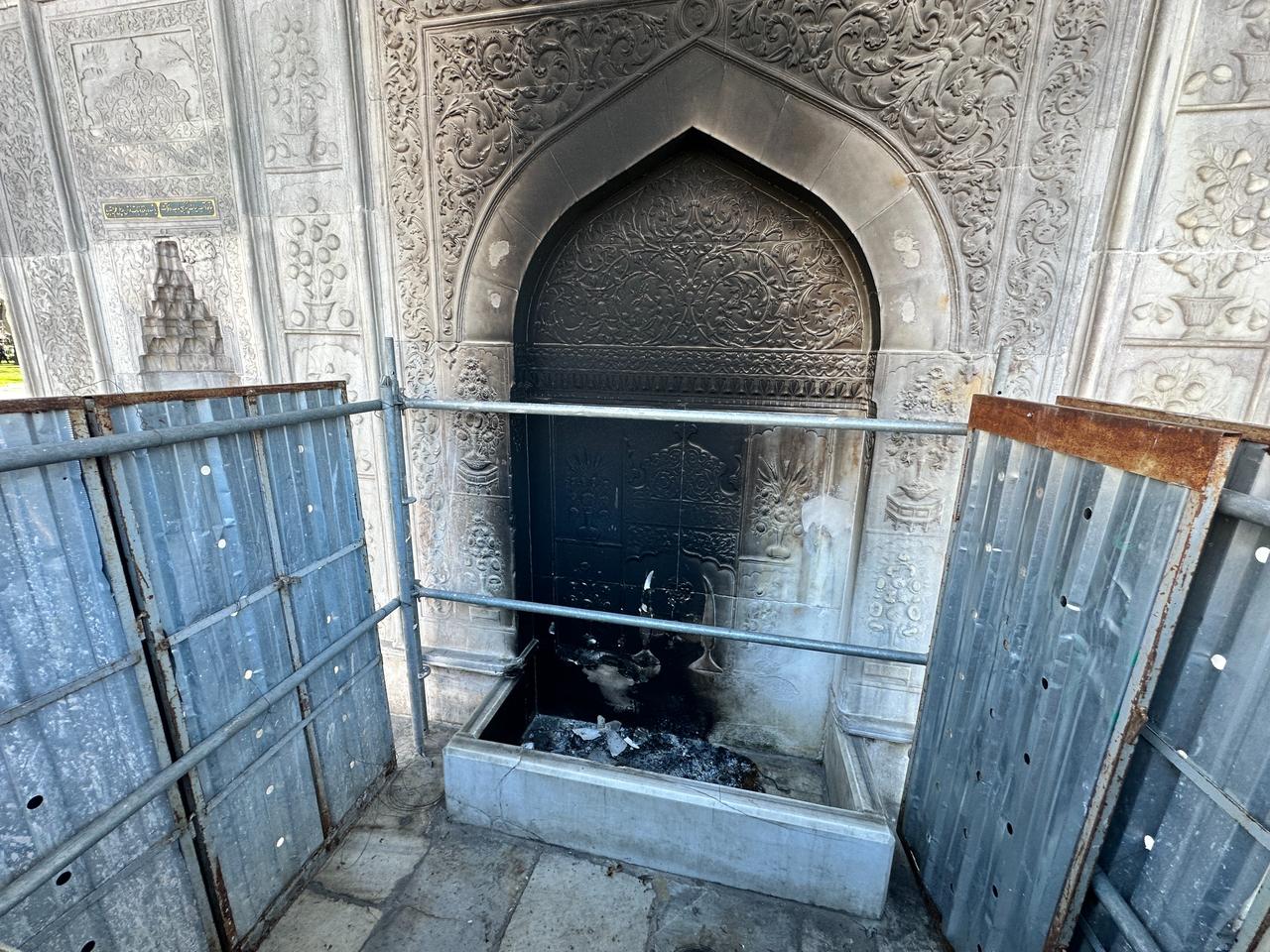 Soot stains are visible around the water tap of the historic Tophane Fountain after a fire was lit against the marble surface in Istanbul, Türkiye, March 8, 2026. (AA Photo)