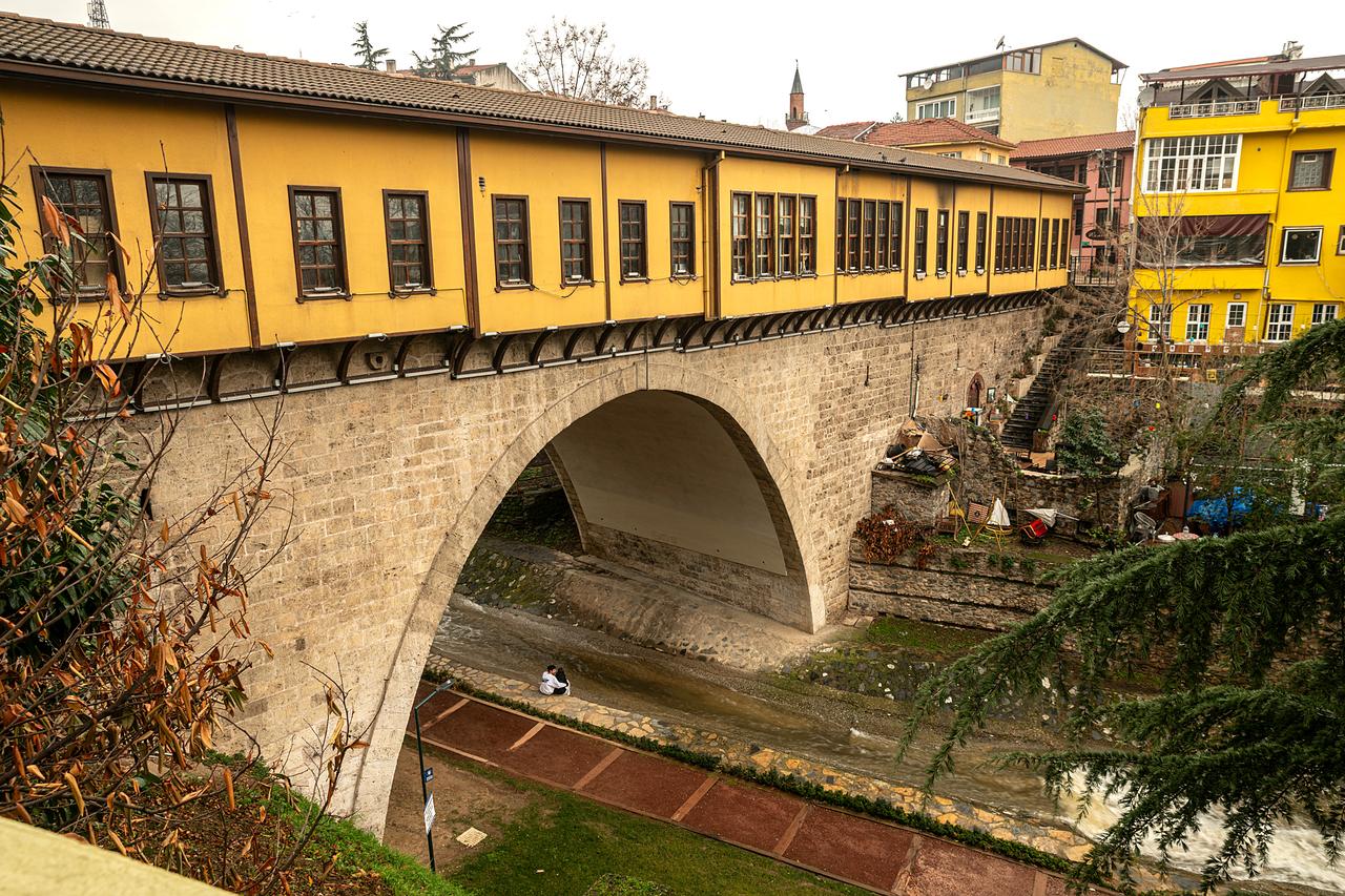The historic Irgandi Bridge, a rare Ottoman bridge with shops built on top, spans the Gokdere stream in Bursa, Türkiye. (Adobe Stock Photo)
