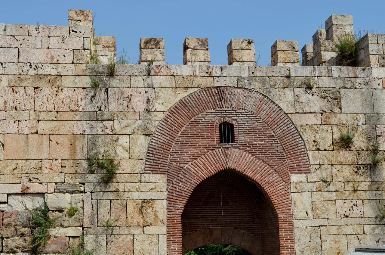Historic city gate and stone fortification walls in Bursa’s Hisar district, reflecting layers of Byzantine and early Ottoman architecture in Bursa, Türkiye. (Adobe Stock Photo)