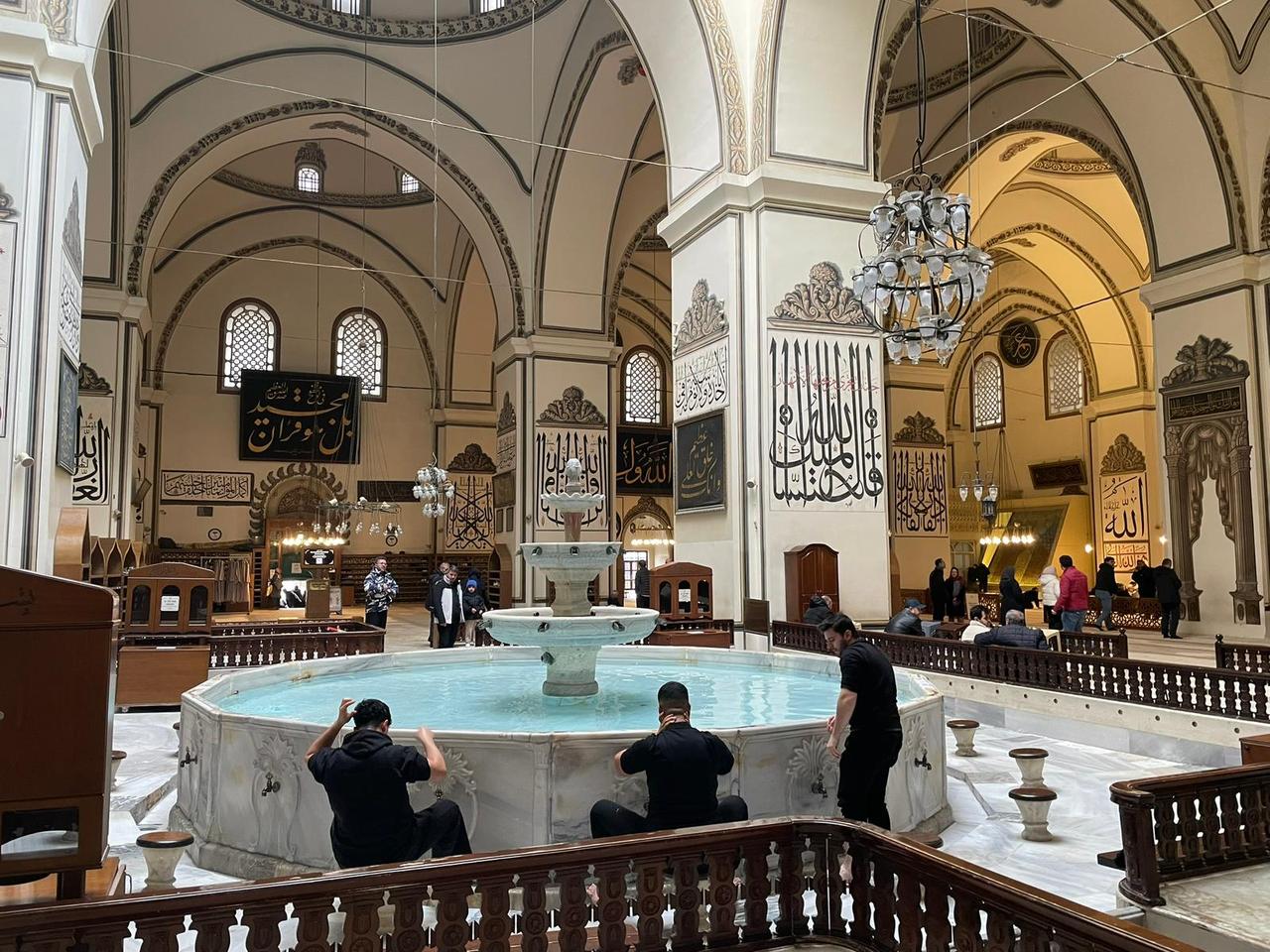 Visitors perform ablution at the central fountain inside the Grand Mosque (Ulu Cami), a landmark of early Ottoman architecture in Bursa, Türkiye, Feb. 25, 2026. (Photo by Koray Erdogan/Türkiye Today)
