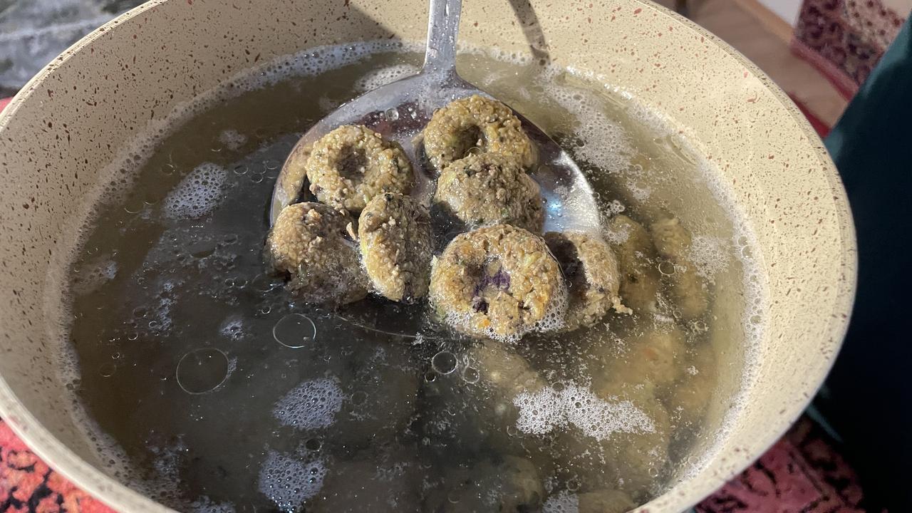 Cooked ciger taplamasi patties are lifted from boiling water during the preparation process in Bitlis, Türkiye, March 9, 2026. (AA Photo)