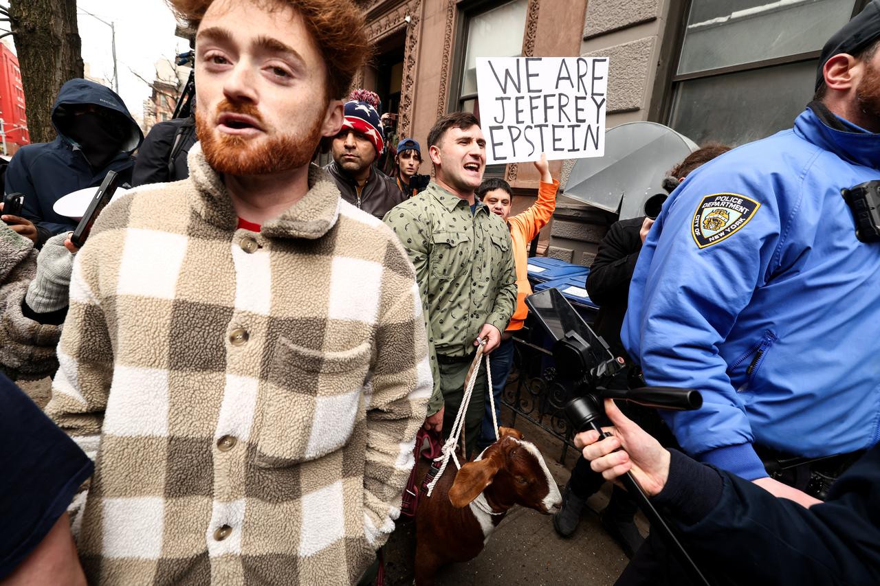 Far-right influencer Jake Lang holds a goat on a leash during a protest organized by him to ask for a "stop of public Muslim prayer" in New York, United States, March 7, 2026. (AFP Photo)