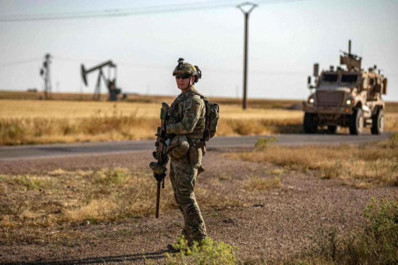 US troops patrol near oil wells in al-Qahtaniyah in Syria’s northeastern Hasakah province, close to the border with Türkiye, June 14, 2023. (AFP Photo)