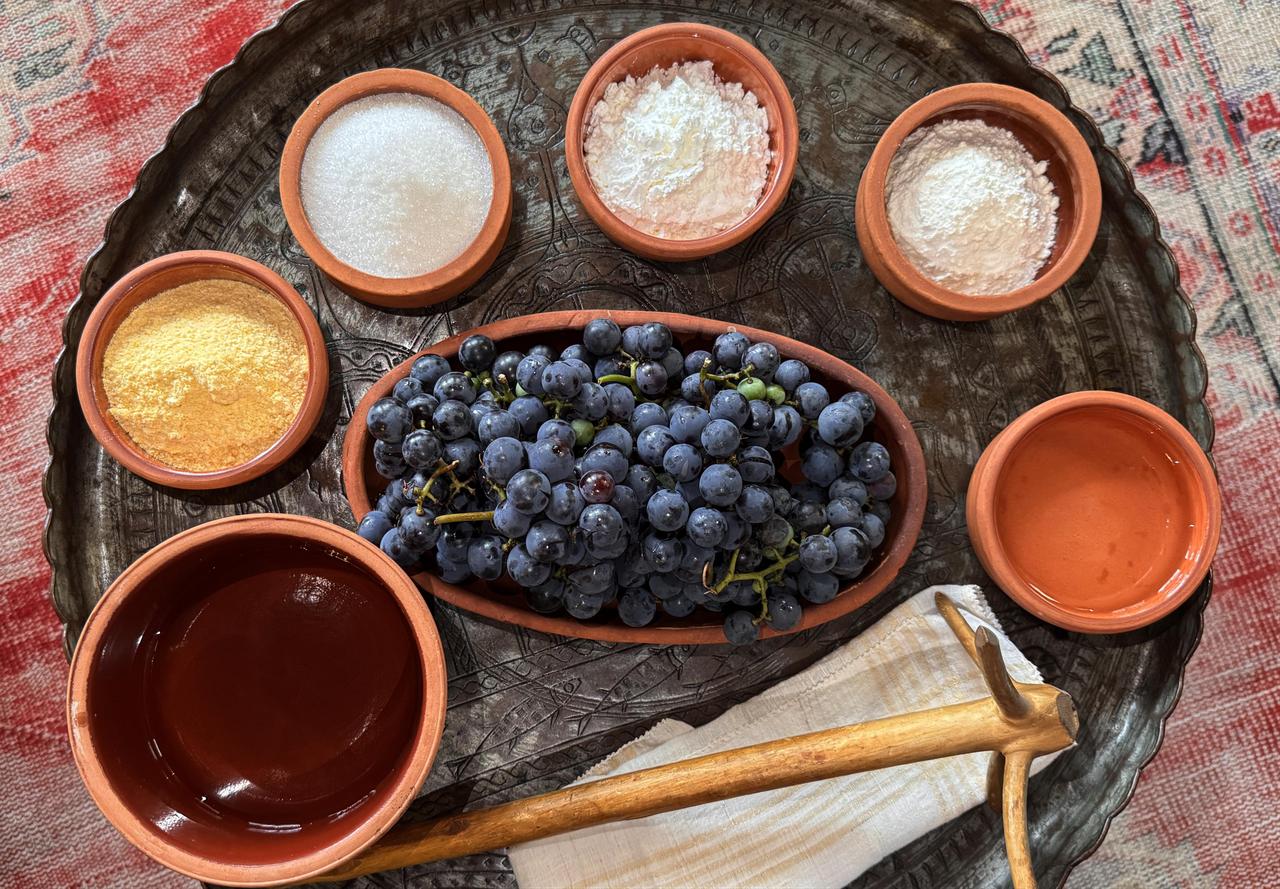 Ingredients used to prepare the traditional Black Sea dessert pepecura, including Isabella grapes, corn flour, wheat flour, starch and sugar, are displayed during the preparation process in Rize, Türkiye, March 7, 2026. (AA Photo)