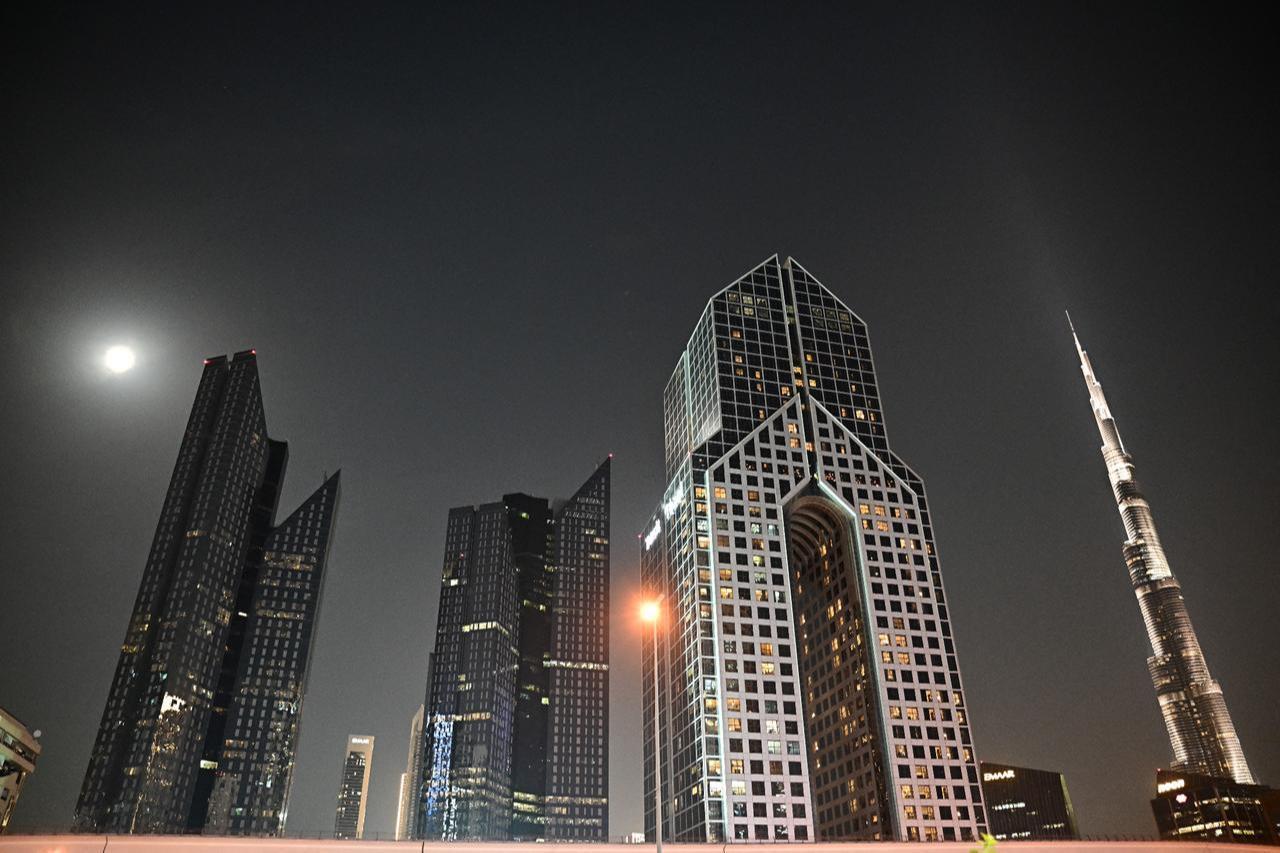 A full moon also known as the "Blood Moon" is seen above down town Dubai, March 3, 2026. (AFP Photo)