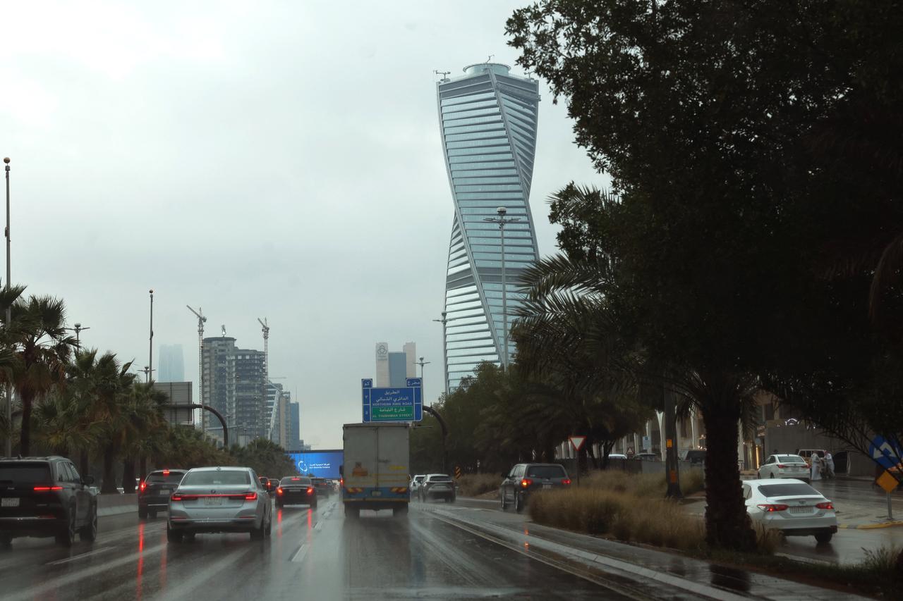 Vehciles drive past skyscrapers along the King Fahad road, a principal transport arteries that links the city's southern and northern districts, in the Saudi capital Riyadh on March 3, 2026. (AFP Photo)