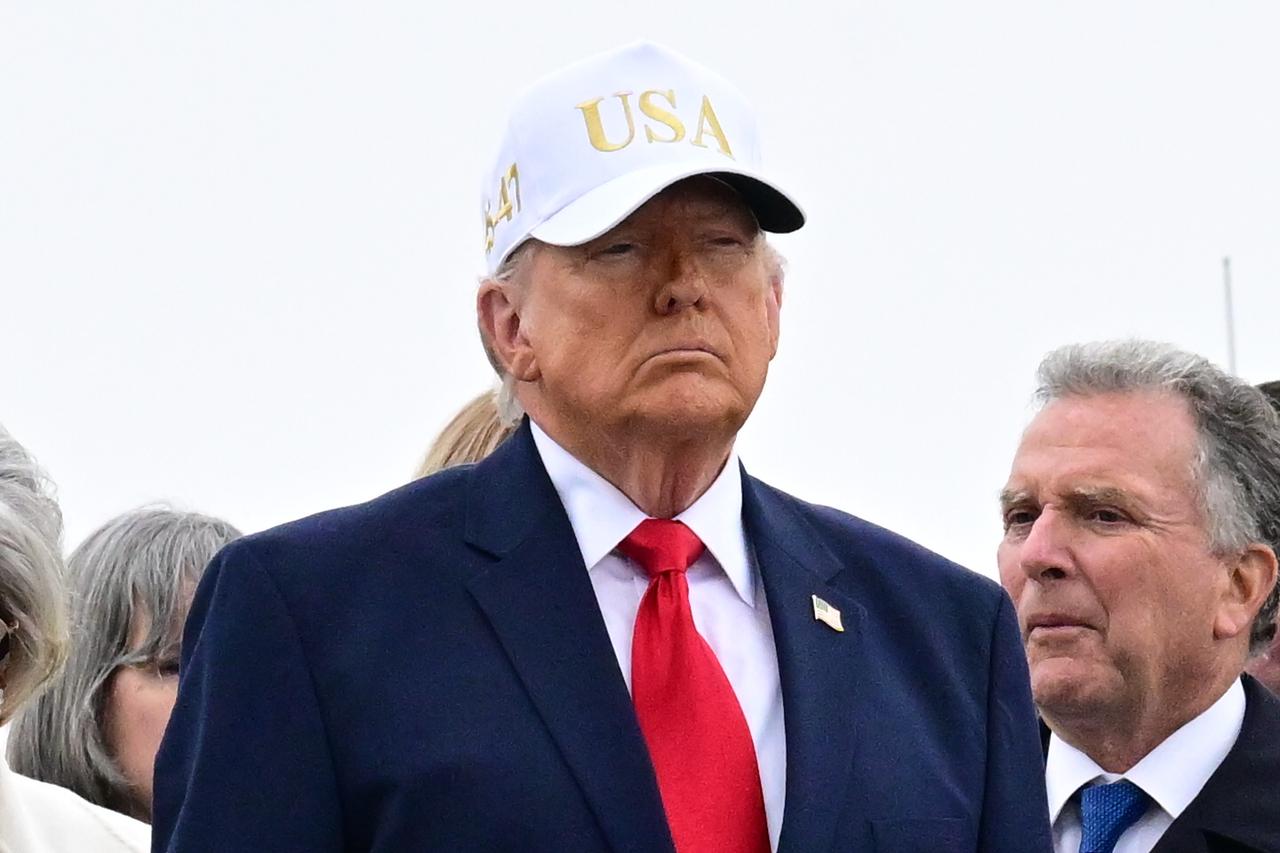 U.S. President Donald Trump salutes flag-draped coffins containing the remains of the US soldiers killed in the retaliatory Iranian strike on Kuwait's Port of Shuaiba, in Dover, Delaware, March 7, 2026. (AA Photo)