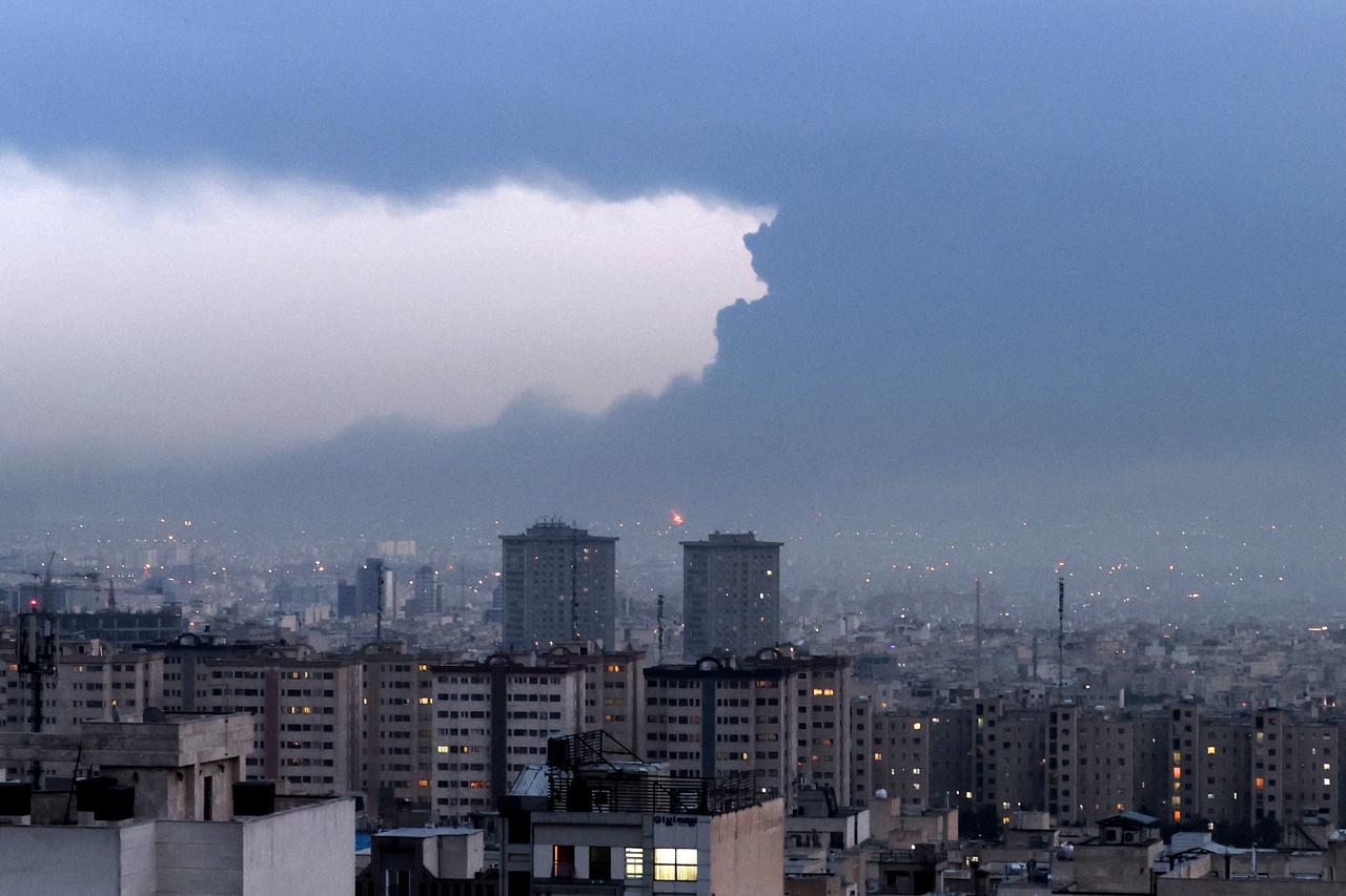 Smoke from the fire at the Tehran Oil Refinery covers the skyline of Tehran on March 8, 2026. (AFP Photo)