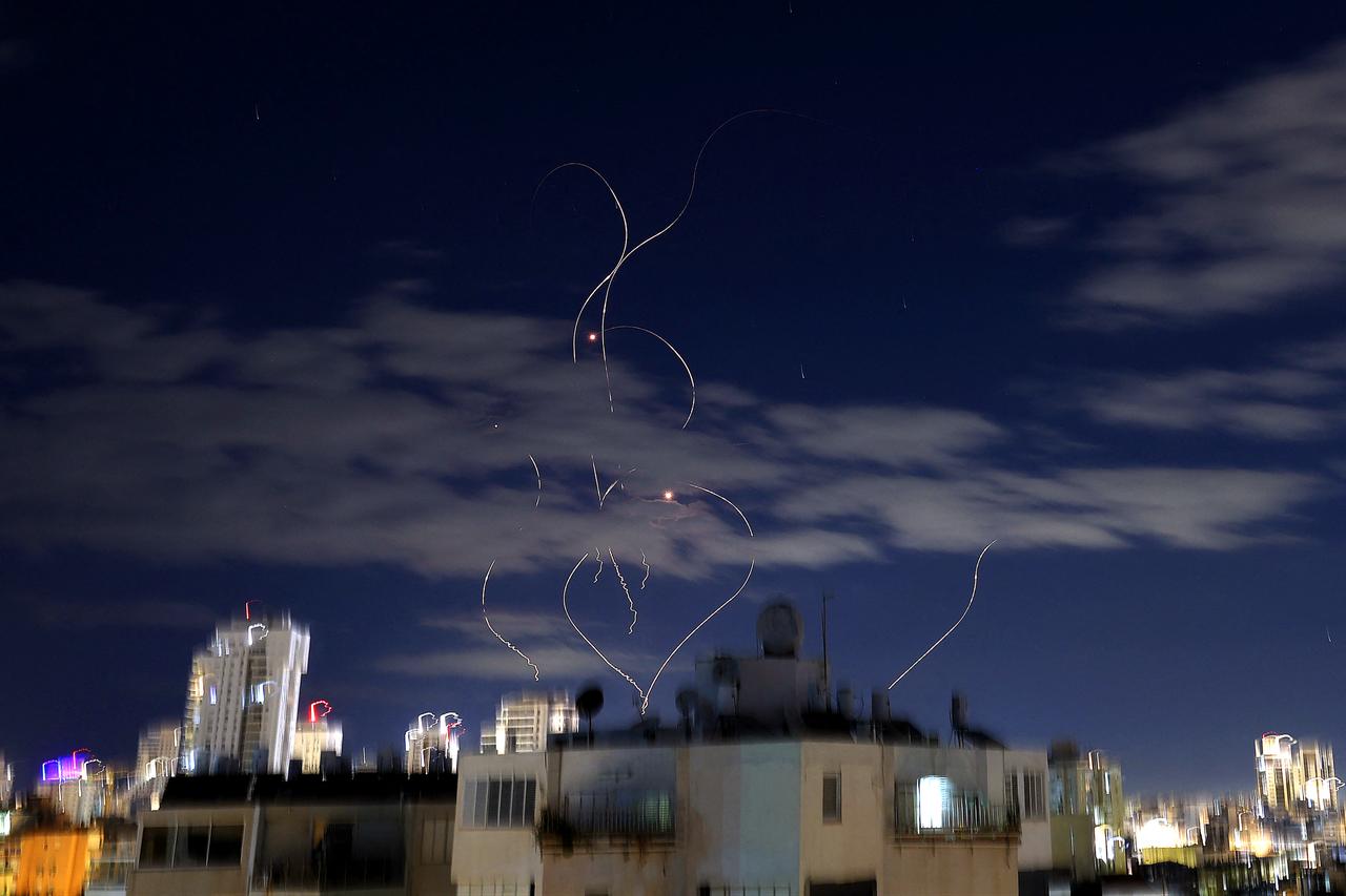 Rocket trails are seen in the sky above the Israeli coastal city of Netanya amid a fresh barrage of Iranian missile attacks on March 9, 2026. (AFP Photo)