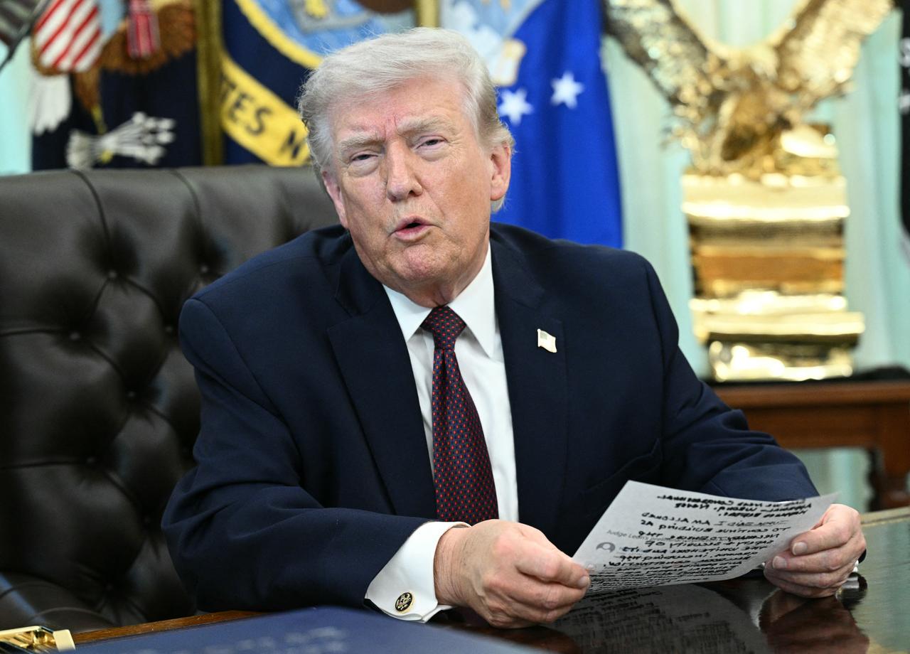US President Donald Trump speaks to the press after signing an executive order in the Oval Office of the White House in Washington, DC, on March 31, 2026. (AFP Photo)