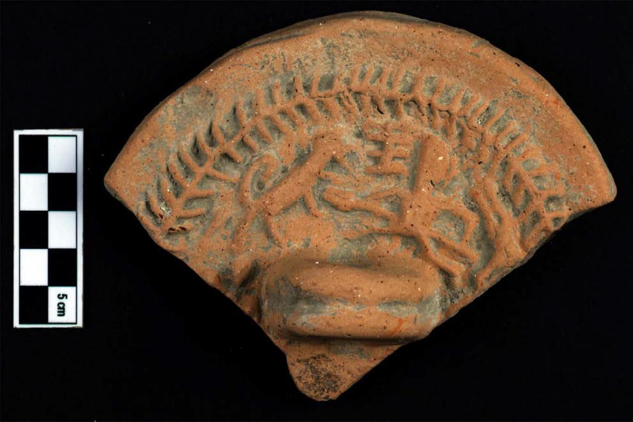 Lid fragment depicting a venatio (hunting spectacle) scene from the Perge stadium. (Photo via ABAAM Archive)